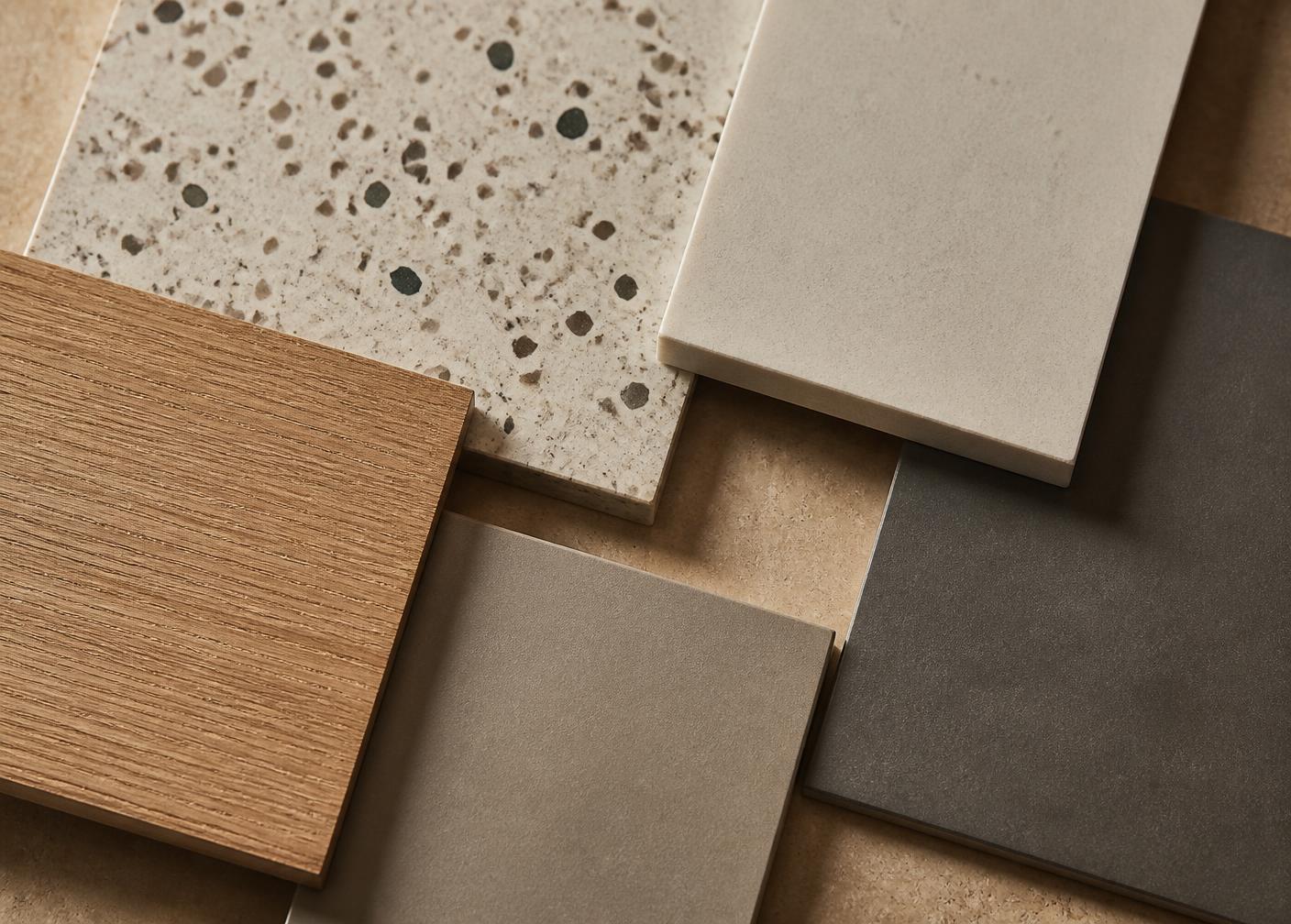 Architectural surface samples: terrazzo, porcelain, quartz and oak veneer